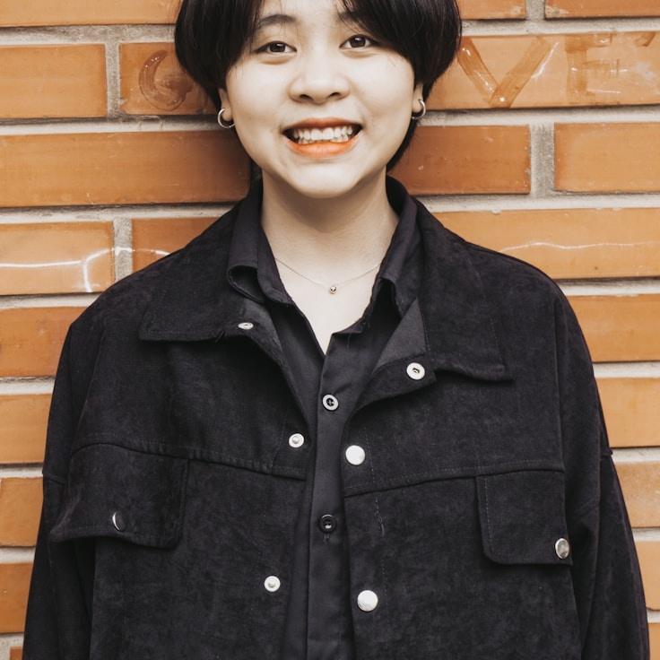 Kaveri Mehta, Lead Design Curator at Grove Field Quill, reviewing corporate floral arrangements